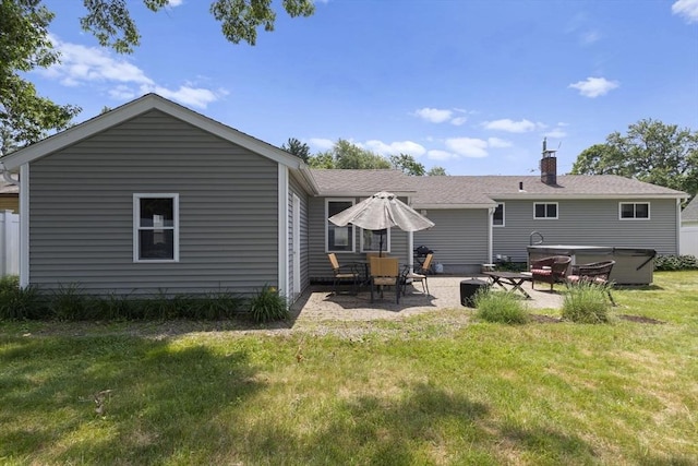 2 Wedgewood Rd, Dover, NH 03820 - back of property featuring a yard, a patio area, a chimney, and roof with shingles