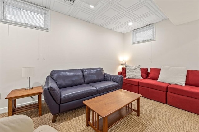 living room with an ornate ceiling and baseboards