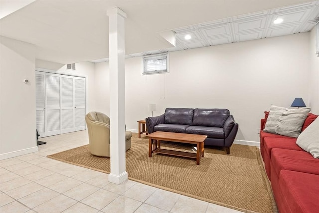 living area featuring light tile patterned floors, baseboards, visible vents, and recessed lighting