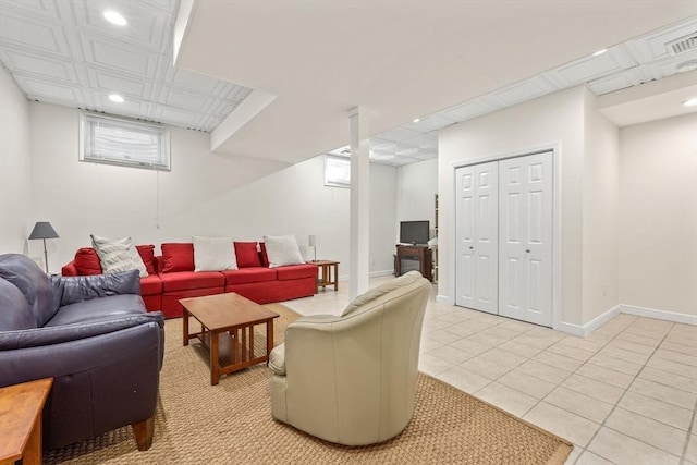 living room with recessed lighting, visible vents, baseboards, and light tile patterned flooring