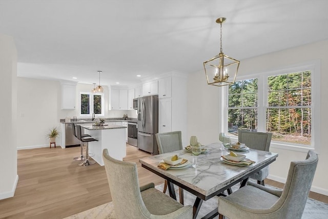 L-244 Doyle Ave, Winchendon, MA 01475 - dining area featuring light wood finished floors, a chandelier, and recessed lighting