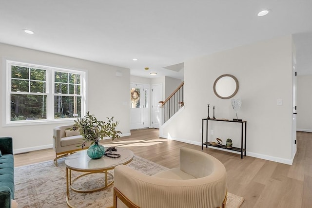 L-244 Doyle Ave, Winchendon, MA 01475 - living room with light wood finished floors, stairway, and recessed lighting