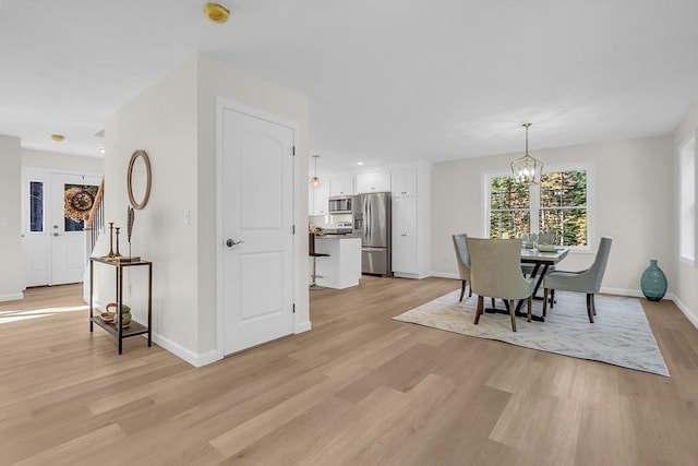 L-244 Doyle Ave, Winchendon, MA 01475 - dining room featuring light wood-style flooring and a chandelier