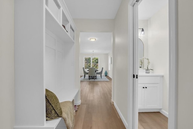 L-244 Doyle Ave, Winchendon, MA 01475 - hallway with light wood-style floors and a chandelier