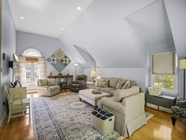 10 Robinhood Rd, Tyngsborough, MA 01879 - living room with vaulted ceiling, a baseboard radiator, and wood finished floors