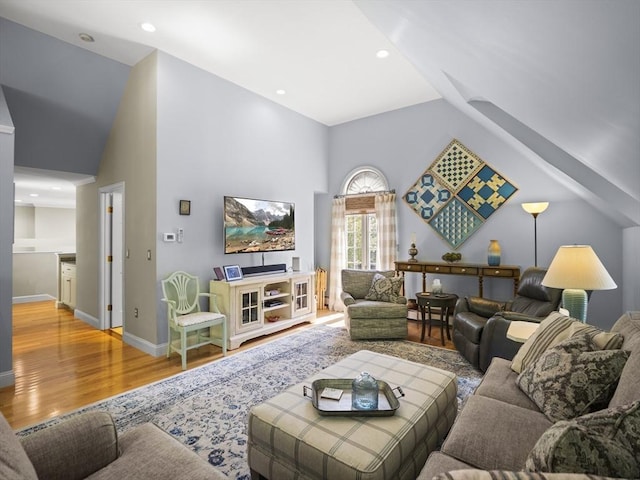 10 Robinhood Rd, Tyngsborough, MA 01879 - living area with wood finished floors, high vaulted ceiling, and baseboards