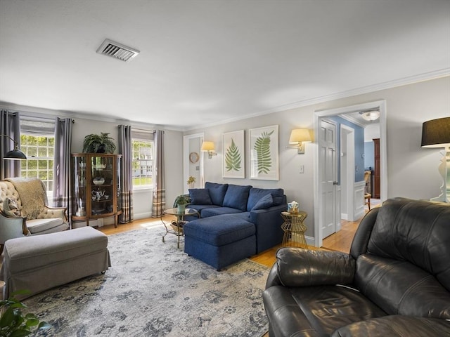 10 Robinhood Rd, Tyngsborough, MA 01879 - living area with crown molding, plenty of natural light, and wood finished floors