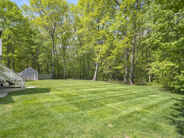 10 Robinhood Rd, Tyngsborough, MA 01879 - view of grassy yard with a shed, an outdoor structure, and stairs