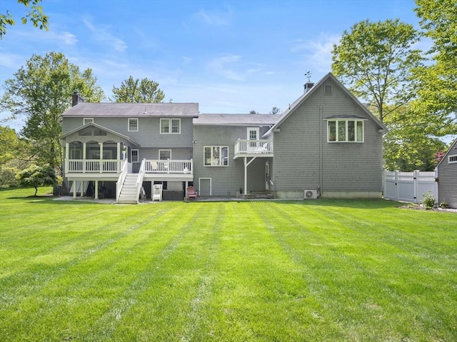 10 Robinhood Rd, Tyngsborough, MA 01879 - rear view of property featuring a sunroom, a deck, and stairs