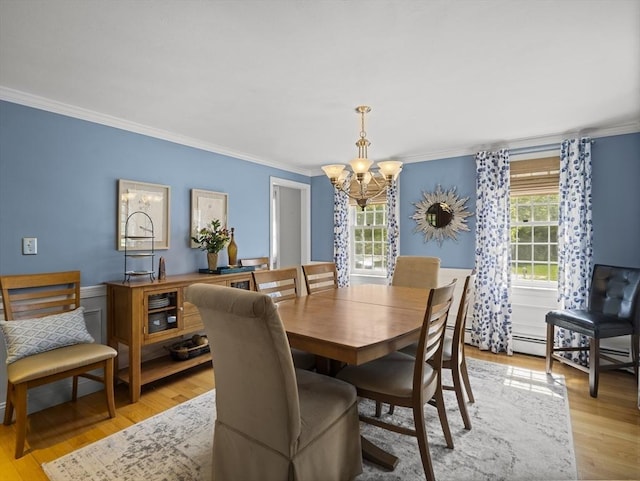 10 Robinhood Rd, Tyngsborough, MA 01879 - dining room with crown molding, a chandelier, and light wood-style floors
