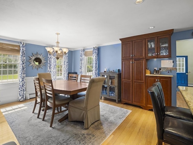 10 Robinhood Rd, Tyngsborough, MA 01879 - dining space featuring a chandelier, light wood finished floors, healthy amount of natural light, and ornamental molding