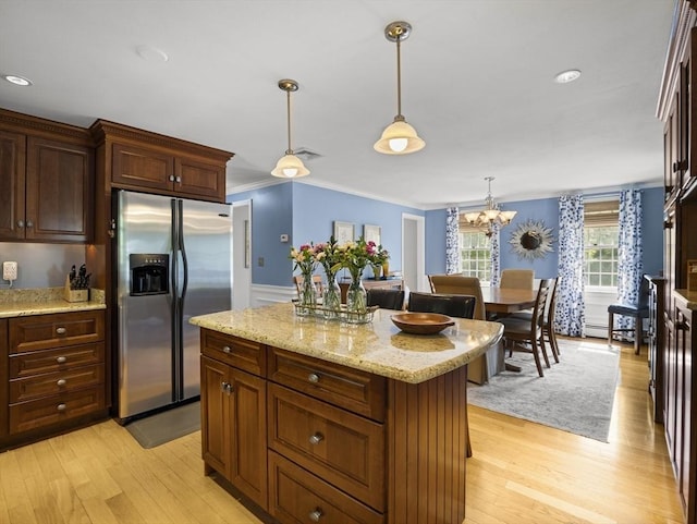 10 Robinhood Rd, Tyngsborough, MA 01879 - kitchen with stainless steel refrigerator with ice dispenser, light wood finished floors, pendant lighting, crown molding, and a kitchen island