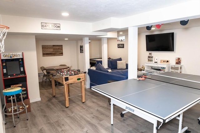 recreation room with recessed lighting, light wood-style floors, and baseboards