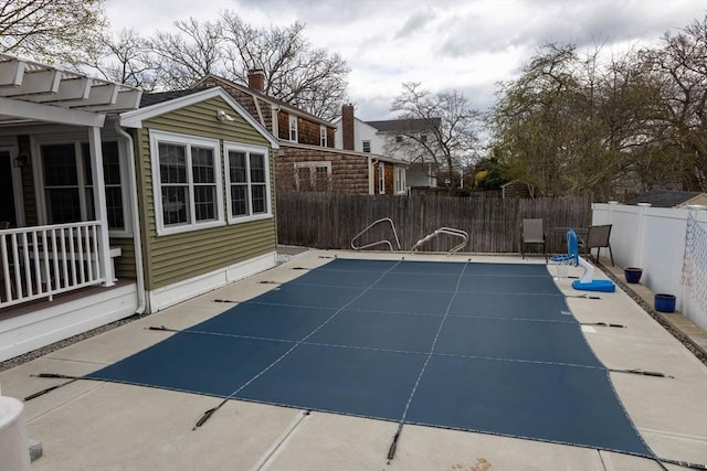 view of pool with a fenced backyard, a fenced in pool, and a patio