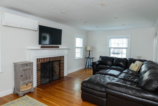 living room featuring crown molding, wood finished floors, and a wall mounted AC