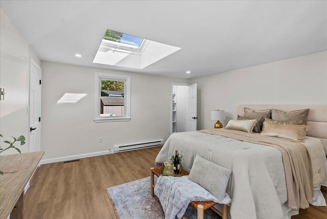 7 Curran Ter, Randolph, MA 02368 - bedroom featuring a skylight, a baseboard radiator, wood finished floors, recessed lighting, and baseboards