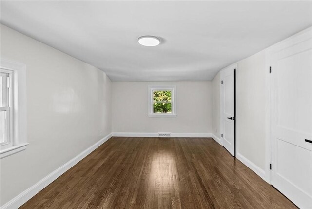 7 Curran Ter, Randolph, MA 02368 - empty room with wood finished floors and baseboards