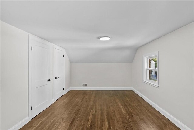 7 Curran Ter, Randolph, MA 02368 - additional living space featuring dark wood-type flooring, baseboards, and lofted ceiling