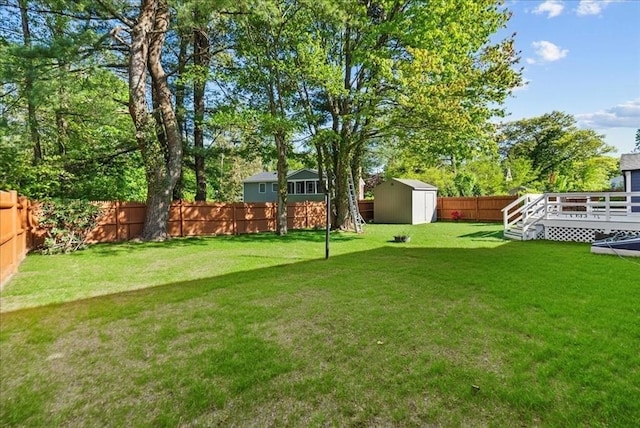 7 Curran Ter, Randolph, MA 02368 - view of yard featuring a shed, a wooden deck, and an outdoor structure