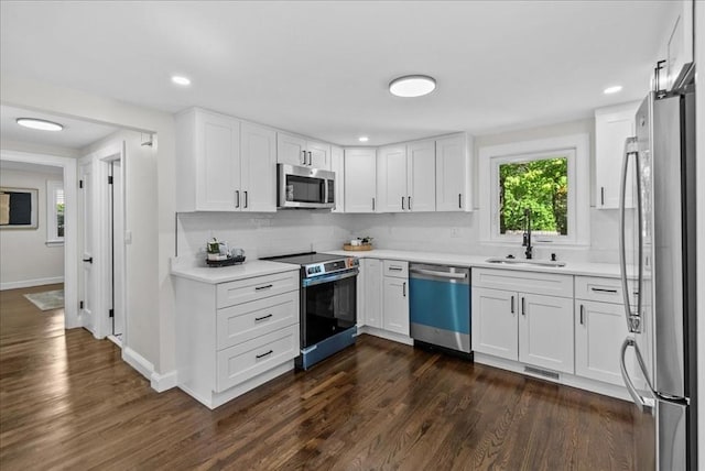 7 Curran Ter, Randolph, MA 02368 - kitchen with appliances with stainless steel finishes, a sink, dark wood finished floors, light countertops, and recessed lighting