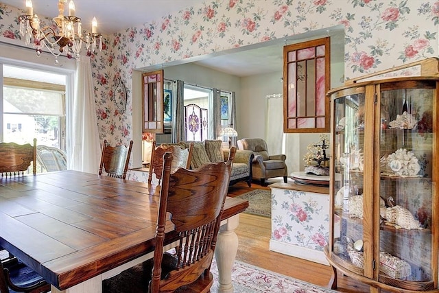 96 Robinson Ave, Attleboro, MA 02703 - dining area with wallpapered walls, a chandelier, and wood finished floors