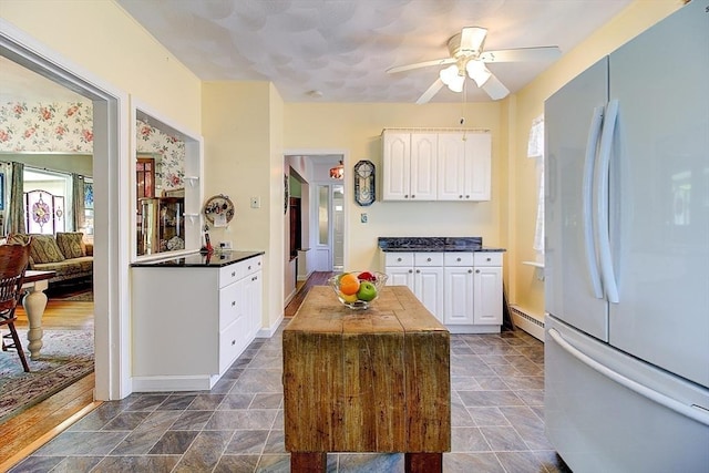 96 Robinson Ave, Attleboro, MA 02703 - kitchen with freestanding refrigerator, healthy amount of natural light, white cabinets, and a ceiling fan