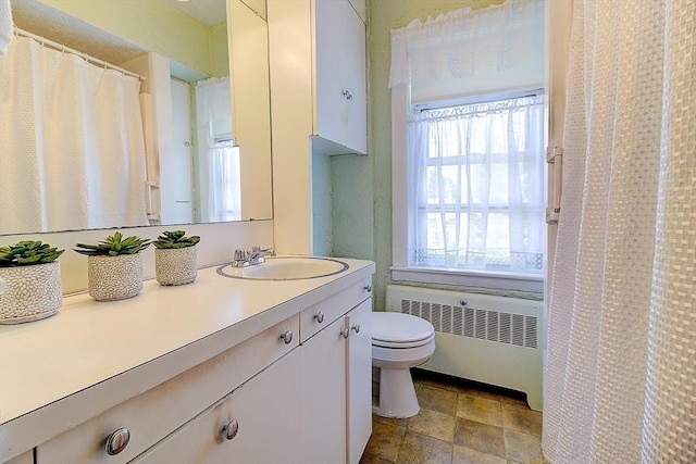 96 Robinson Ave, Attleboro, MA 02703 - full bathroom featuring radiator heating unit, vanity, stone finish floors, and a shower with shower curtain