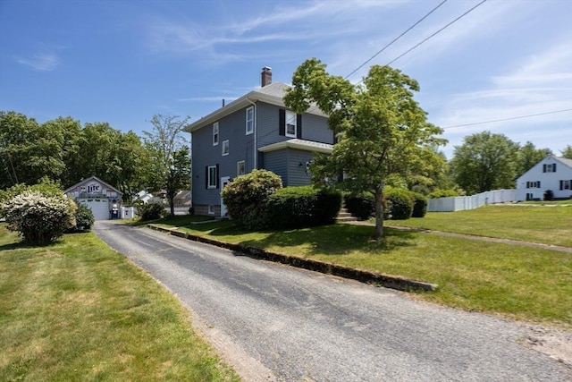 96 Robinson Ave, Attleboro, MA 02703 - view of front of home with an outbuilding, a detached garage, and a chimney