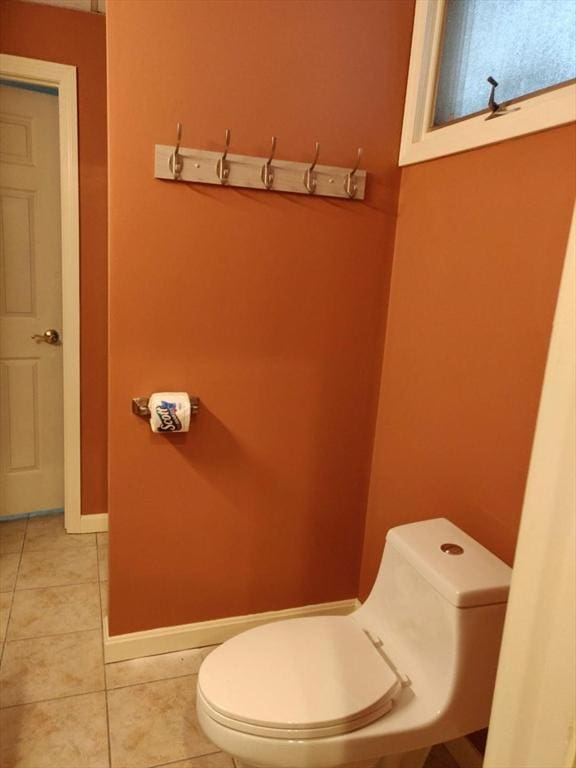 bathroom with tile patterned floors and toilet