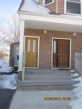 view of snow covered property entrance