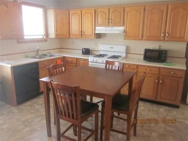 kitchen with black appliances and sink