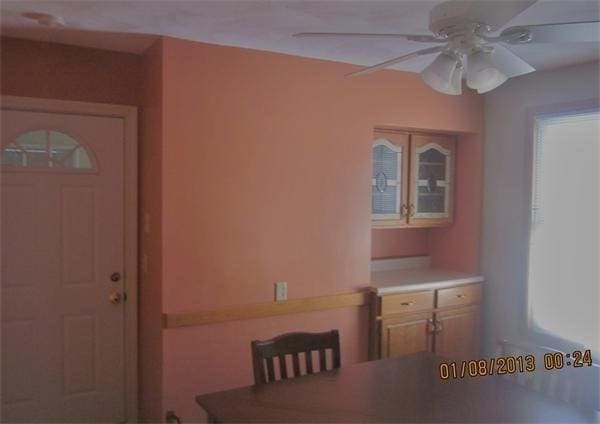 unfurnished dining area featuring ceiling fan