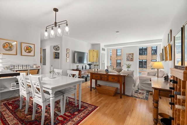 80 Broad St Unit 1002, Boston, MA 02110 - dining room with light wood finished floors and electric panel