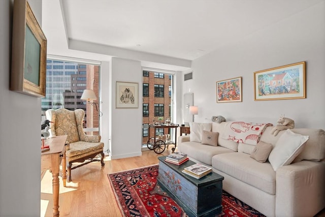 80 Broad St Unit 1002, Boston, MA 02110 - living area featuring light wood finished floors, baseboards, and visible vents
