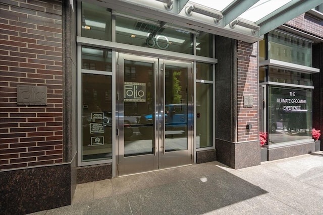 80 Broad St Unit 1002, Boston, MA 02110 - property entrance featuring brick siding and french doors