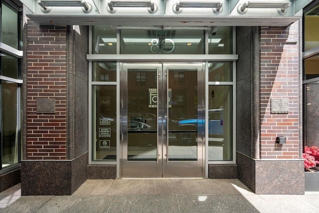 80 Broad St Unit 1002, Boston, MA 02110 - entrance to property featuring brick siding and french doors