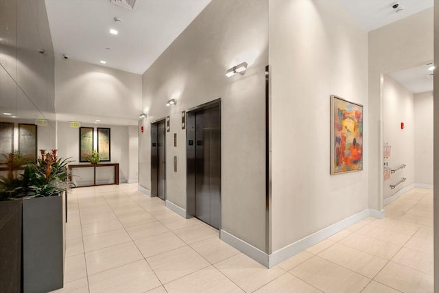 80 Broad St Unit 1002, Boston, MA 02110 - hall featuring baseboards, elevator, recessed lighting, and light tile patterned flooring