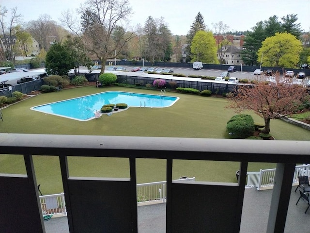 view of pool featuring fence