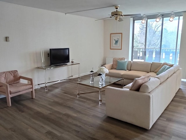 living room with a ceiling fan and wood finished floors