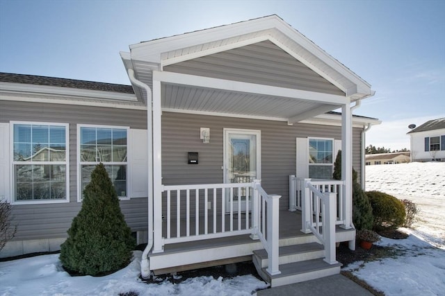 view of snow covered property entrance