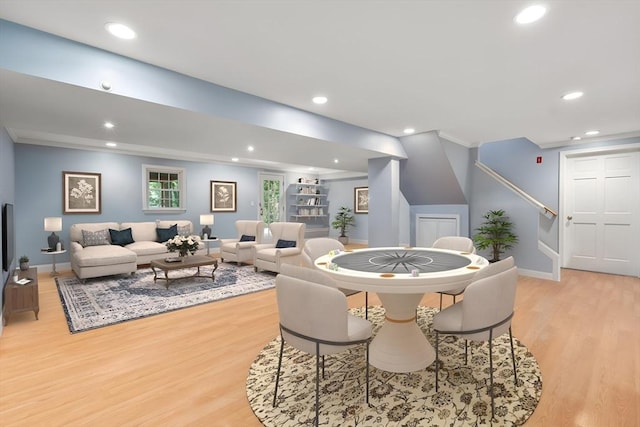 dining area with recessed lighting, baseboards, stairway, and light wood finished floors