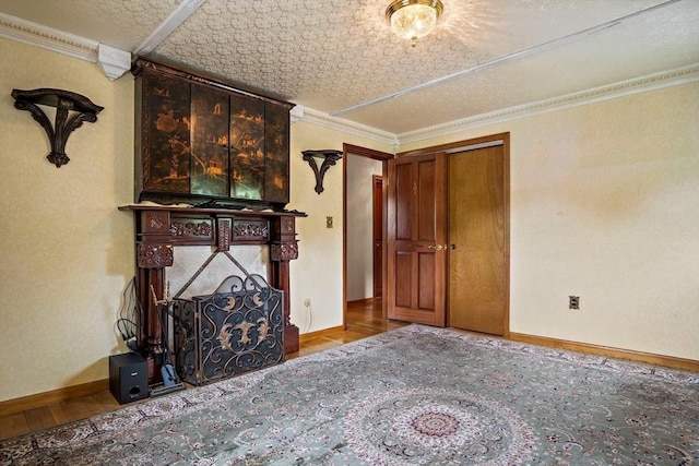 12 Cassidy Dr, Woburn, MA 01801 - unfurnished living room featuring wood finished floors, ornamental molding, and baseboards