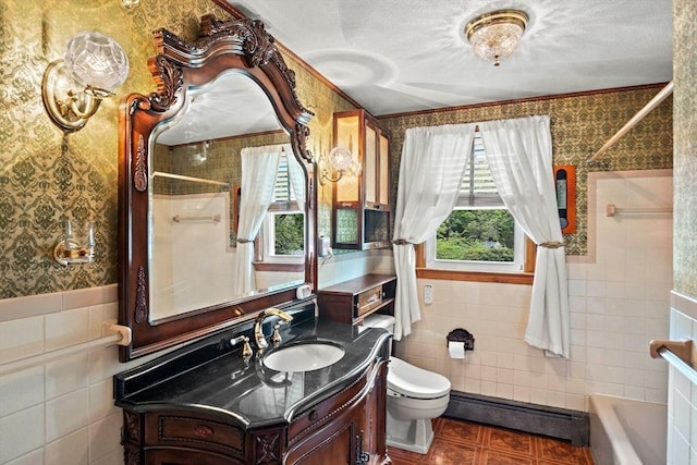 12 Cassidy Dr, Woburn, MA 01801 - bathroom with tile walls, wallpapered walls, baseboard heating, plenty of natural light, and toilet