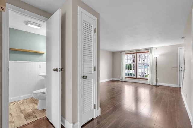 hallway featuring dark hardwood / wood-style flooring