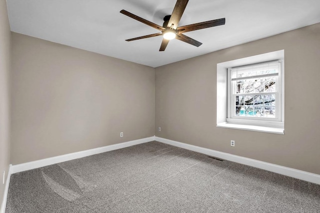 unfurnished room with carpet flooring and ceiling fan