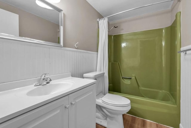 full bathroom with shower / bath combo, vanity, toilet, and hardwood / wood-style floors