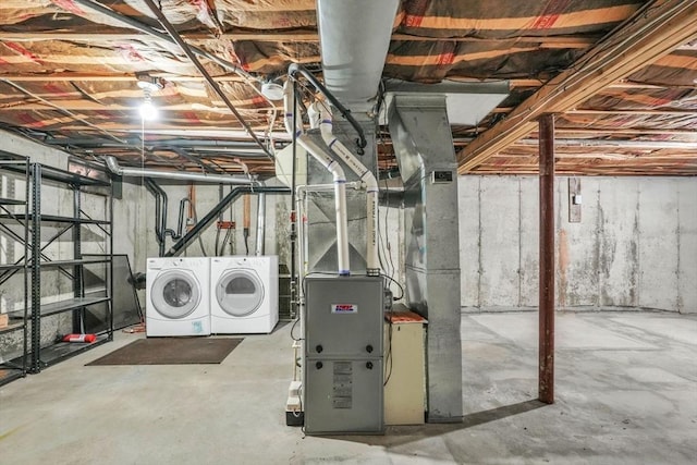 basement with washing machine and clothes dryer