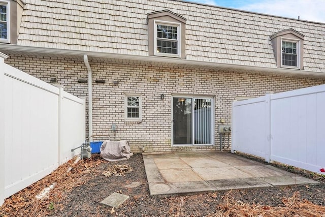 back of house featuring a patio