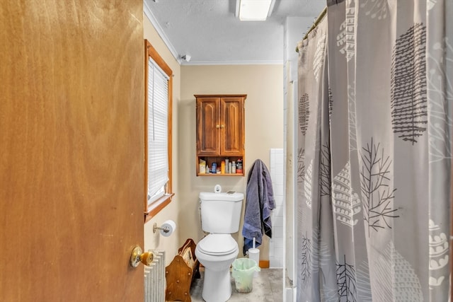 bathroom featuring toilet, tile patterned flooring, ornamental molding, a textured ceiling, and walk in shower