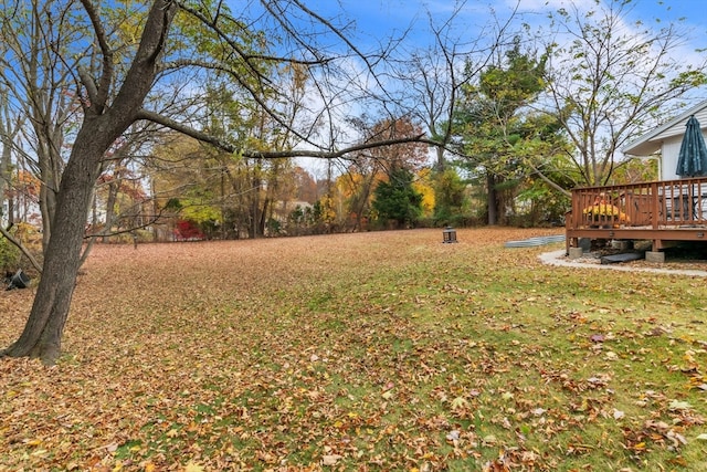 view of yard featuring a wooden deck